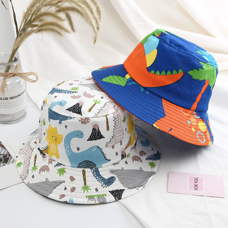 Baby boy wearing a cartoon animal and cactus pattern sunshade bowl hat, showcasing its vibrant colors and adjustable chin strap.