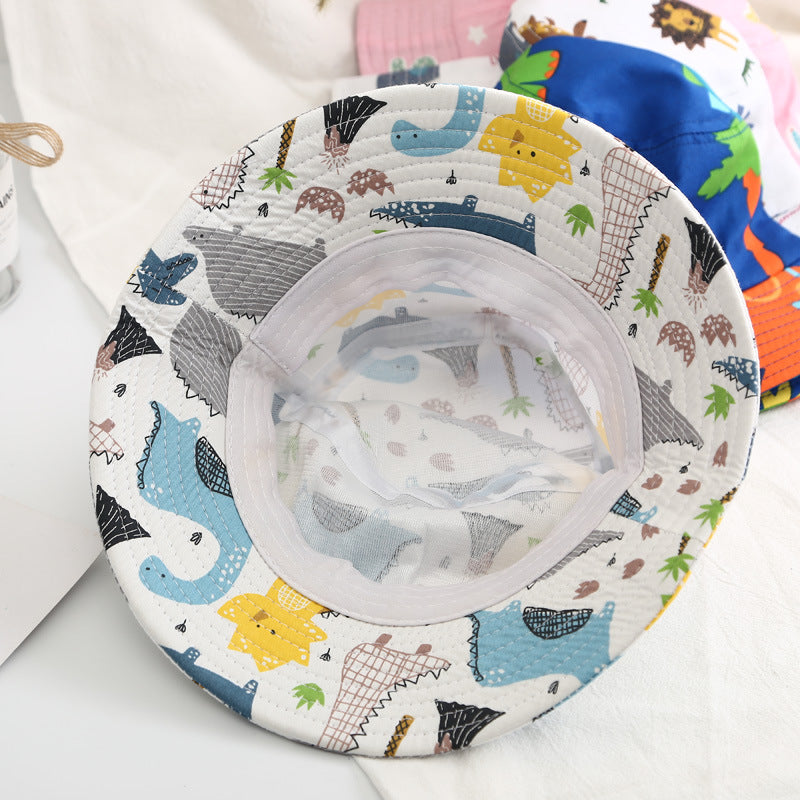 Baby boy wearing a cartoon animal and cactus pattern sunshade bowl hat, showcasing its vibrant colors and adjustable chin strap.