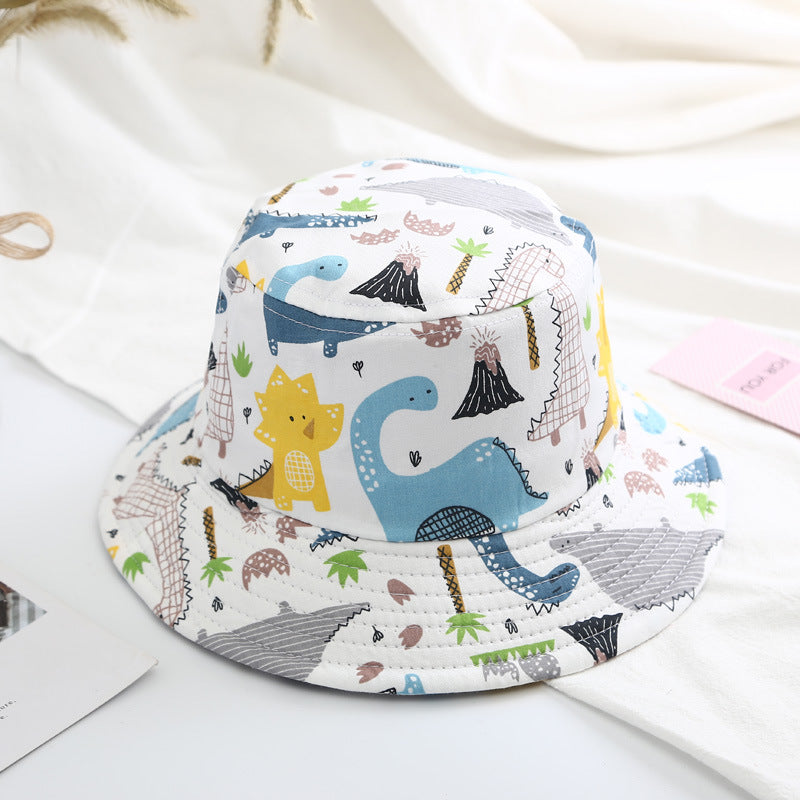 Baby boy wearing a cartoon animal and cactus pattern sunshade bowl hat, showcasing its vibrant colors and adjustable chin strap.