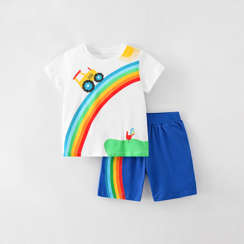 Baby boy wearing a soft cotton cartoon print clothing set in blue, featuring playful designs and comfortable fit.