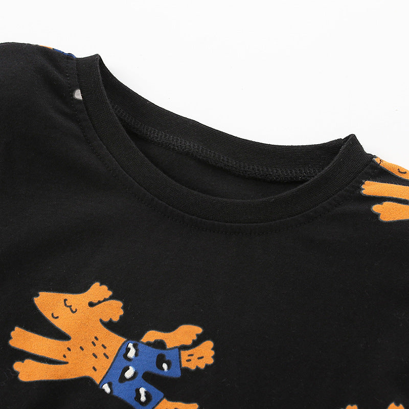 Baby boy wearing a cute dog print pattern O-neck cotton shirt, showcasing a playful design and comfortable fit.