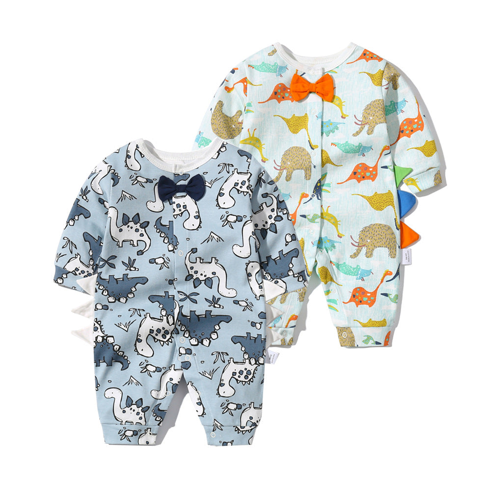 Baby boy wearing a dinosaur patterned bow tie romper with snap button closure, featuring a fun patched design.