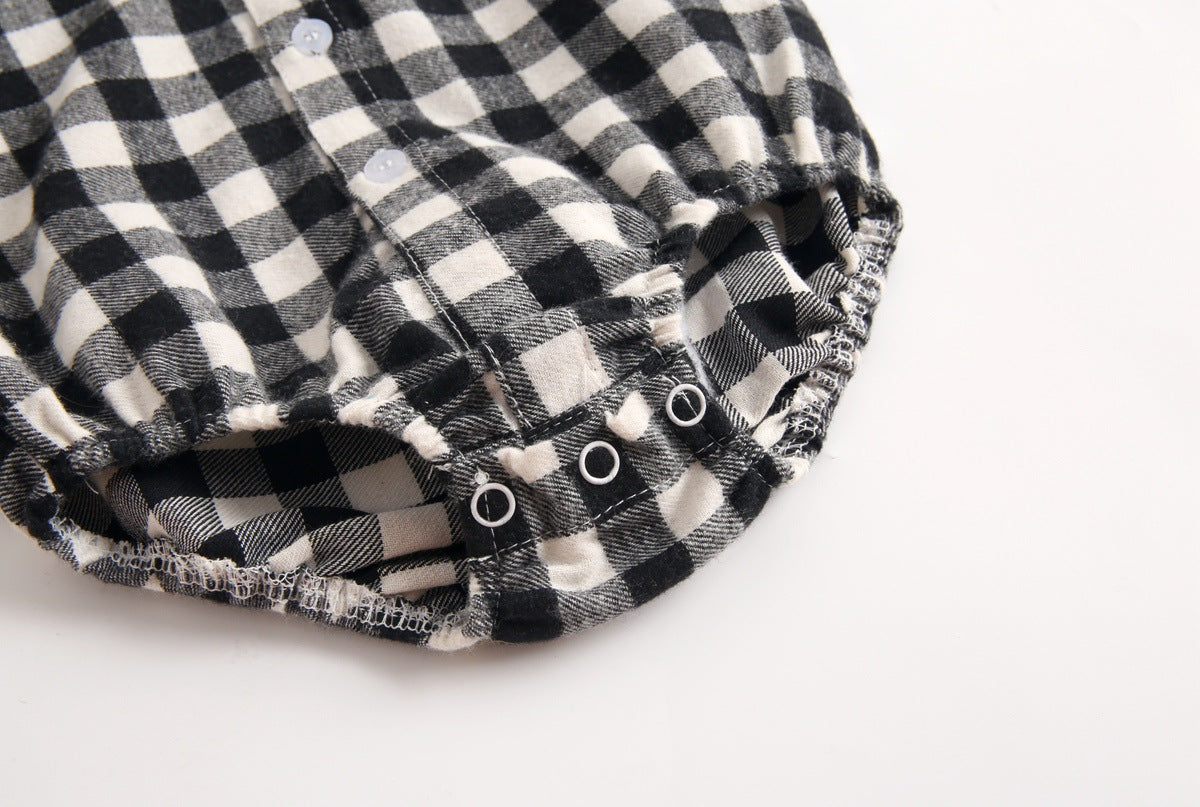 Baby boy wearing a plaid pattern buttoned shirt onesie with pockets, showcasing a stylish and comfortable design.