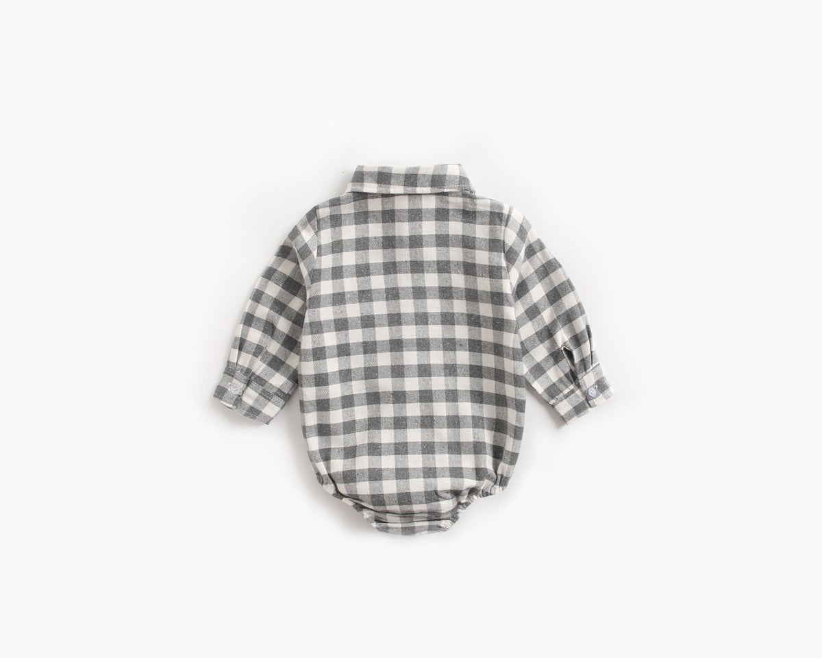 Baby boy wearing a plaid pattern buttoned shirt onesie with pockets, showcasing a stylish and comfortable design.