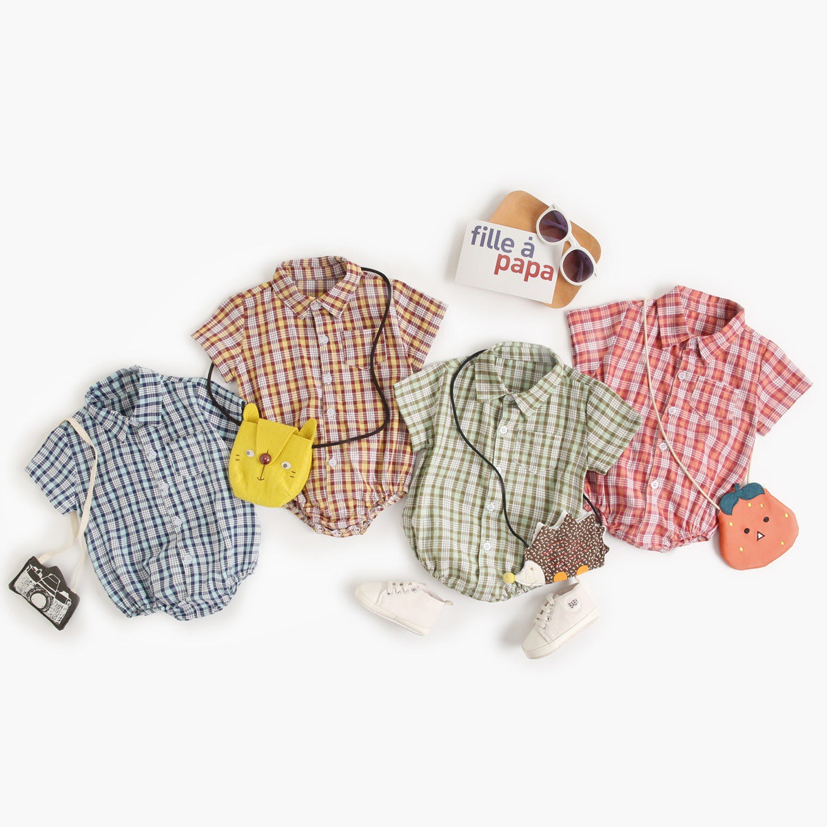 Baby boy wearing a plaid pattern college style onesie in vibrant colors, showcasing comfort and style.