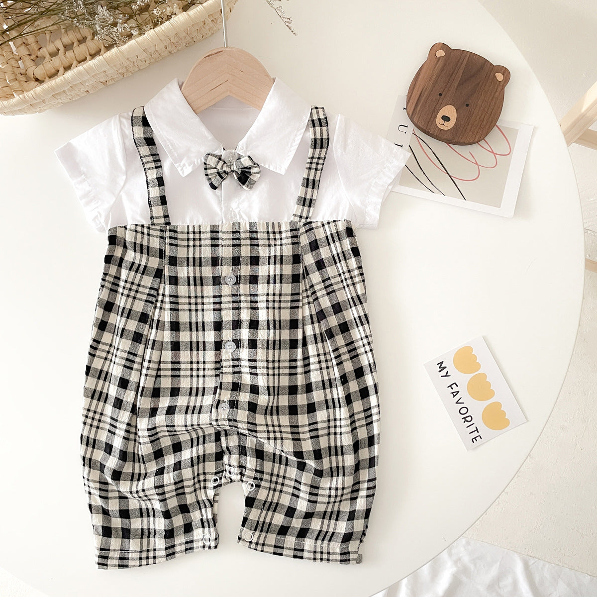 Baby boy plaid pattern polo-neck romper in black and coffee colors, made from soft cotton fabric.