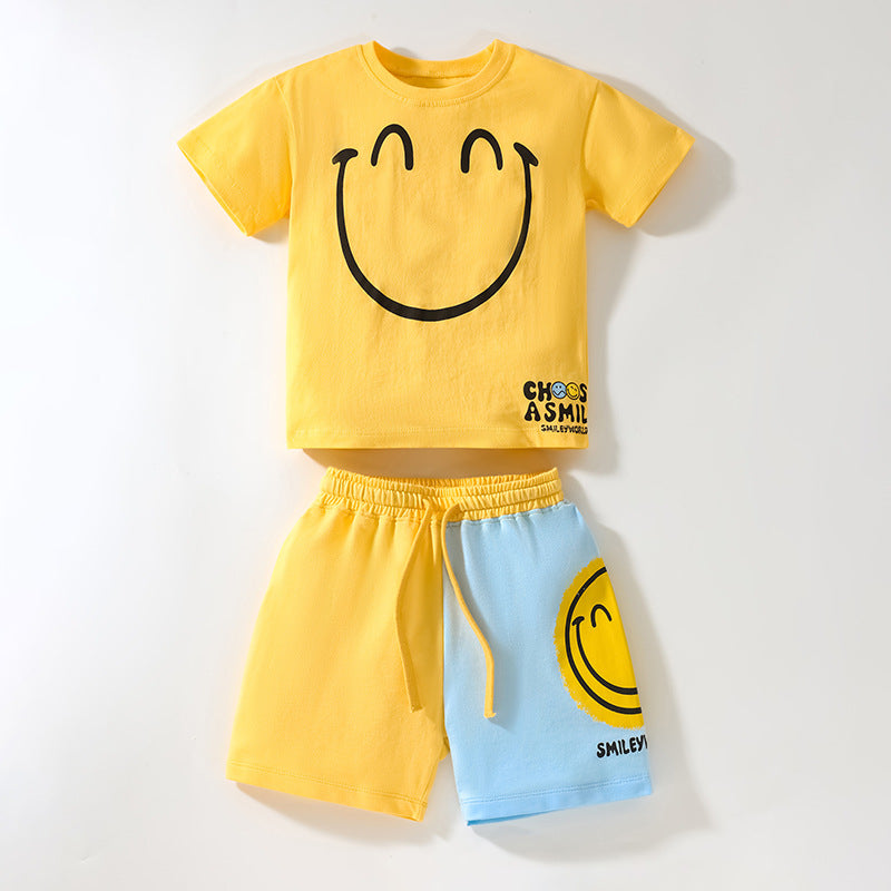 Baby boy clothing set featuring a bright yellow smile print pattern, made from soft cotton, perfect for summer wear.