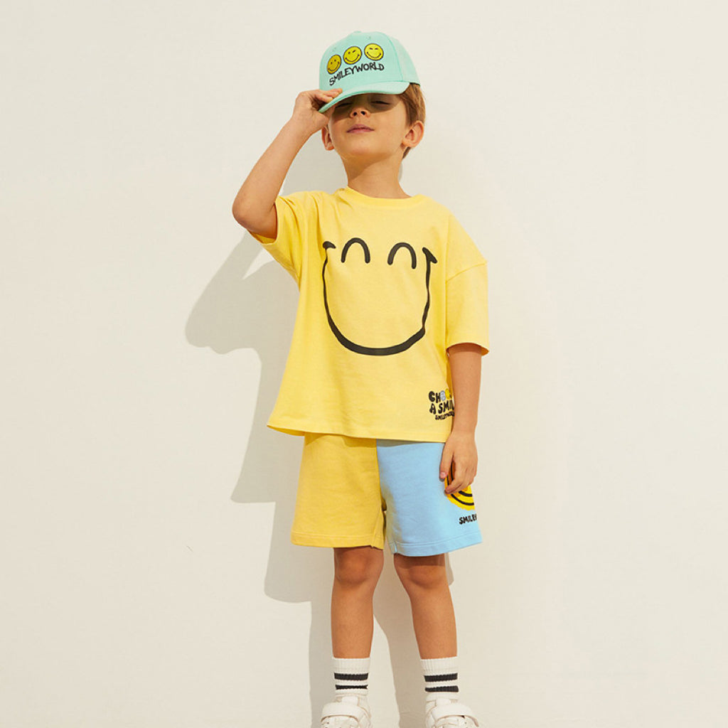 Baby boy clothing set featuring a bright yellow smile print pattern, made from soft cotton, perfect for summer wear.