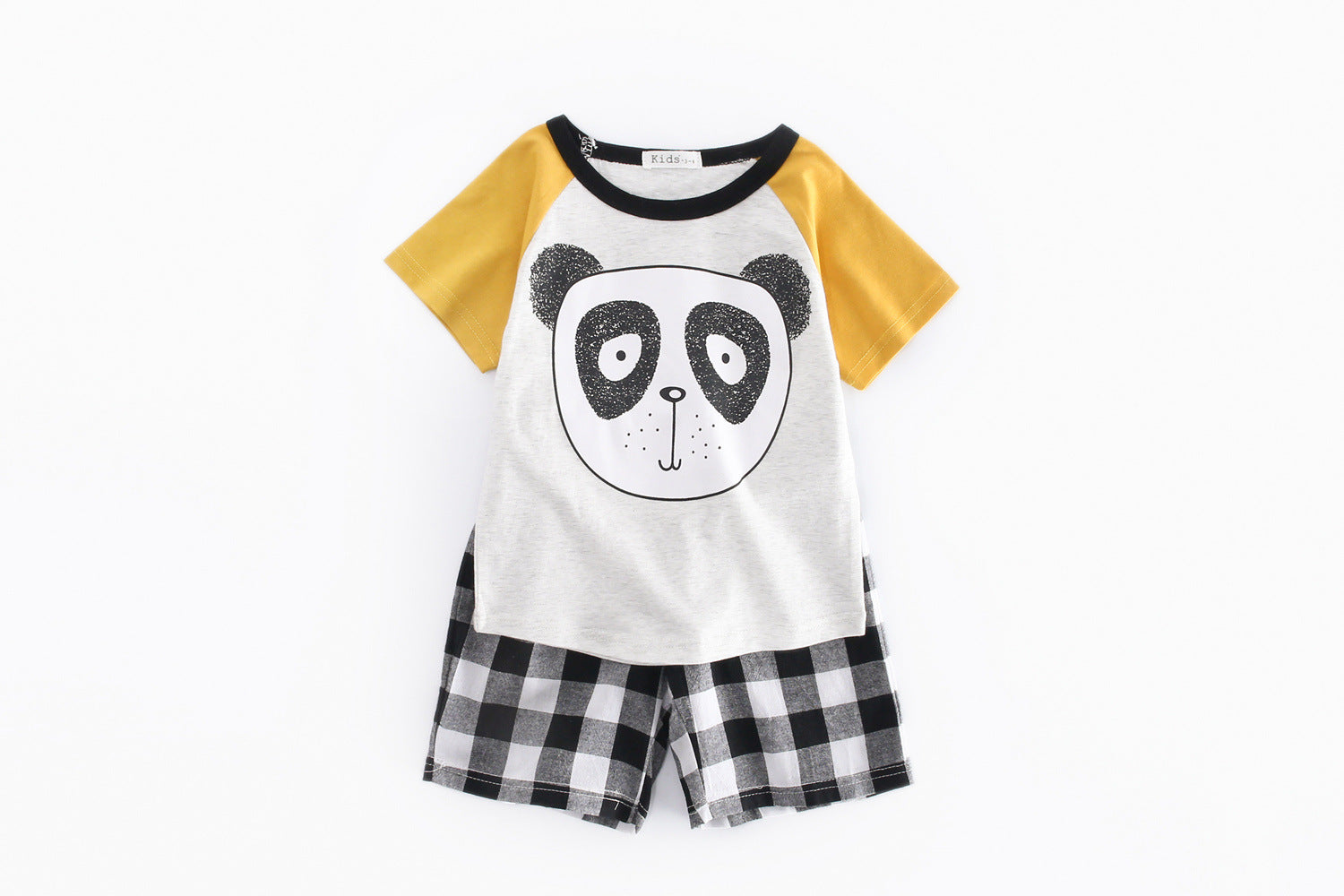 A vibrant yellow short-sleeved top with a bear print, paired with plaid shorts, perfect for baby boys.