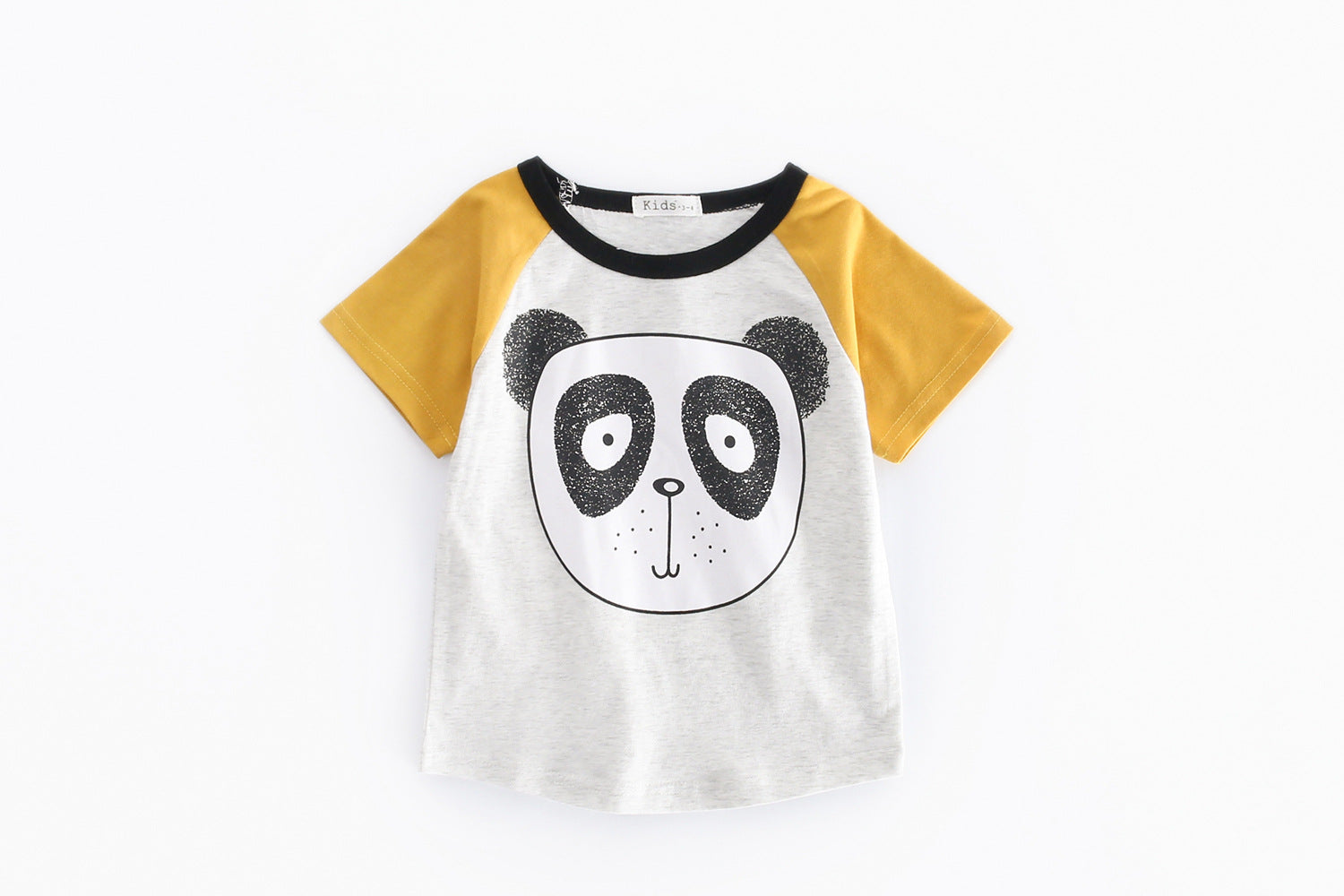 A vibrant yellow short-sleeved top with a bear print, paired with plaid shorts, perfect for baby boys.