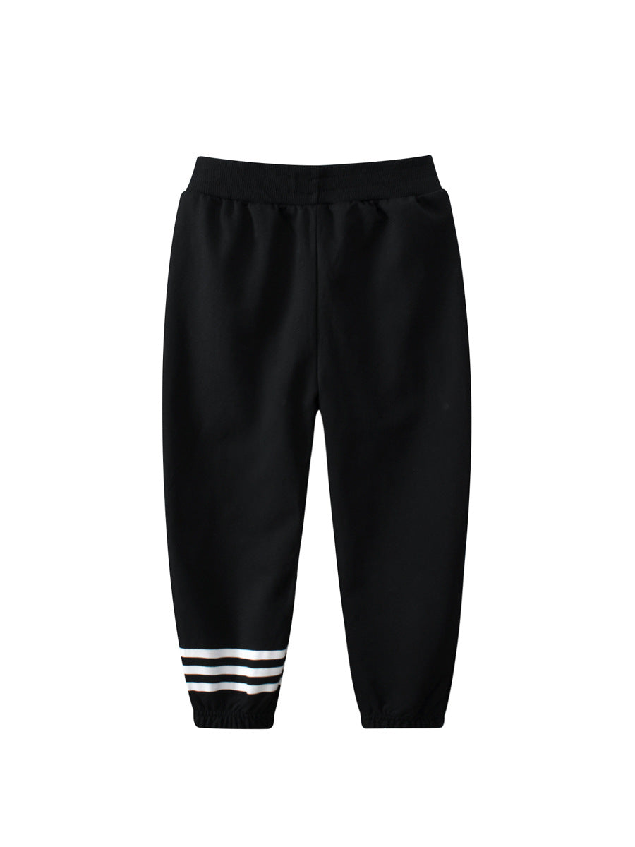 Baby boys black and white striped sports trousers with pockets, made from cotton, suitable for active toddlers.