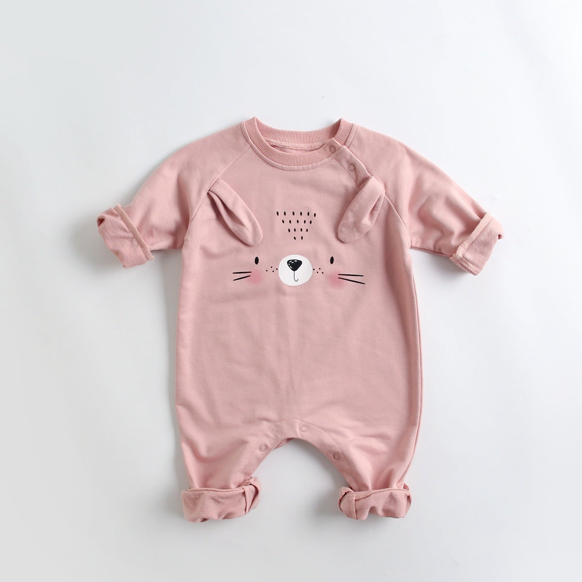 A soft cotton baby romper featuring a cute cartoon animal pattern, designed for comfort with long sleeves and footed legs.