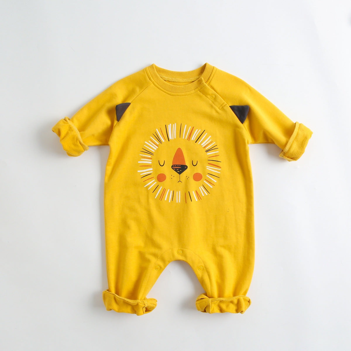 A soft cotton baby romper featuring a cute cartoon animal pattern, designed for comfort with long sleeves and footed legs.