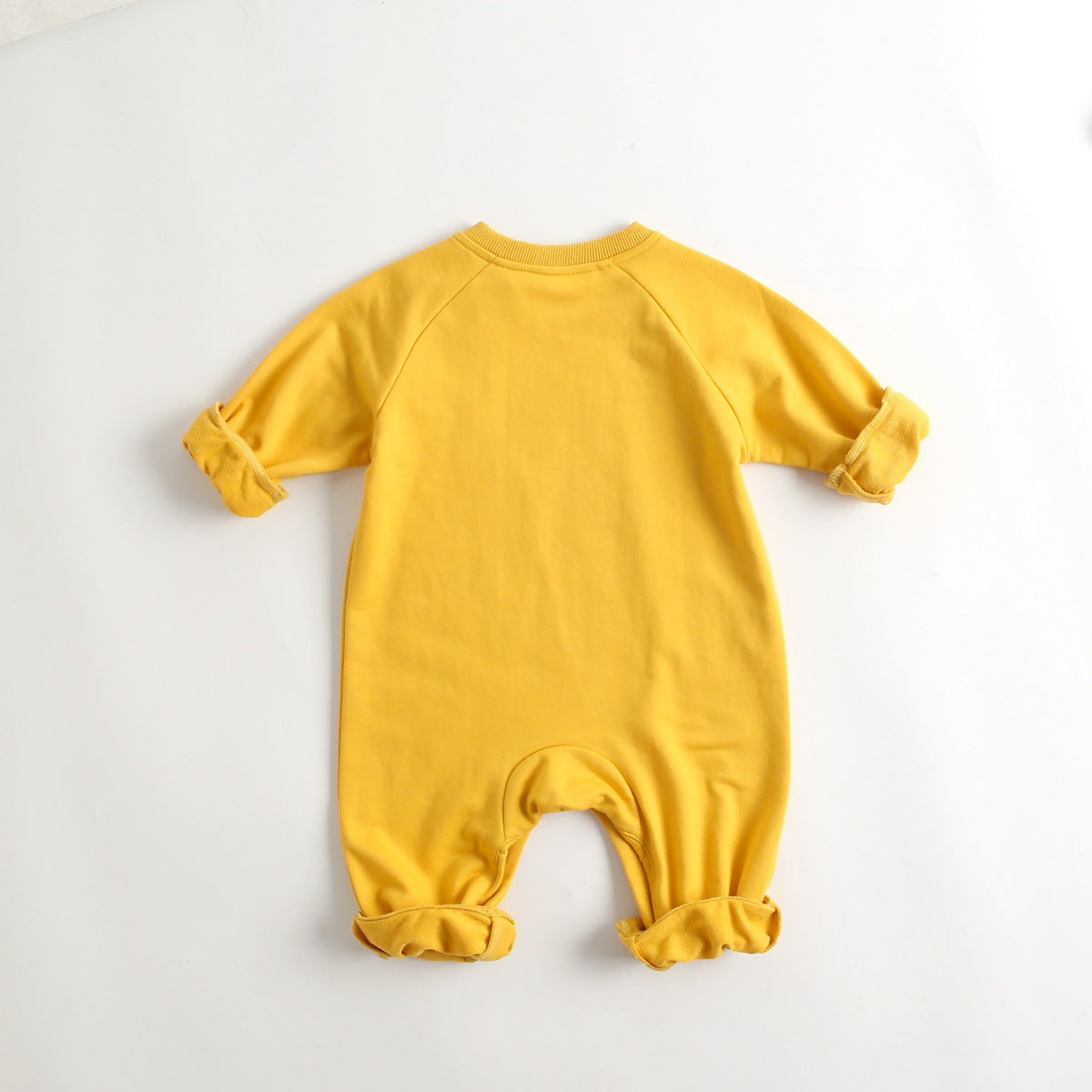 A soft cotton baby romper featuring a cute cartoon animal pattern, designed for comfort with long sleeves and footed legs.