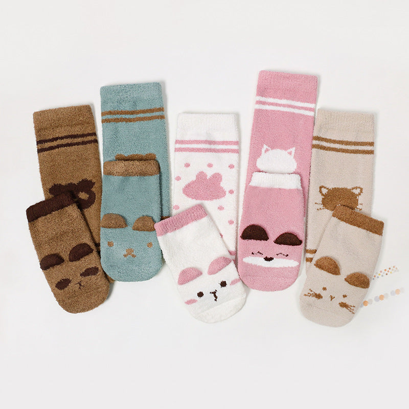 A pair of warm long socks for babies featuring a colorful cartoon animal print pattern, designed for comfort and safety.