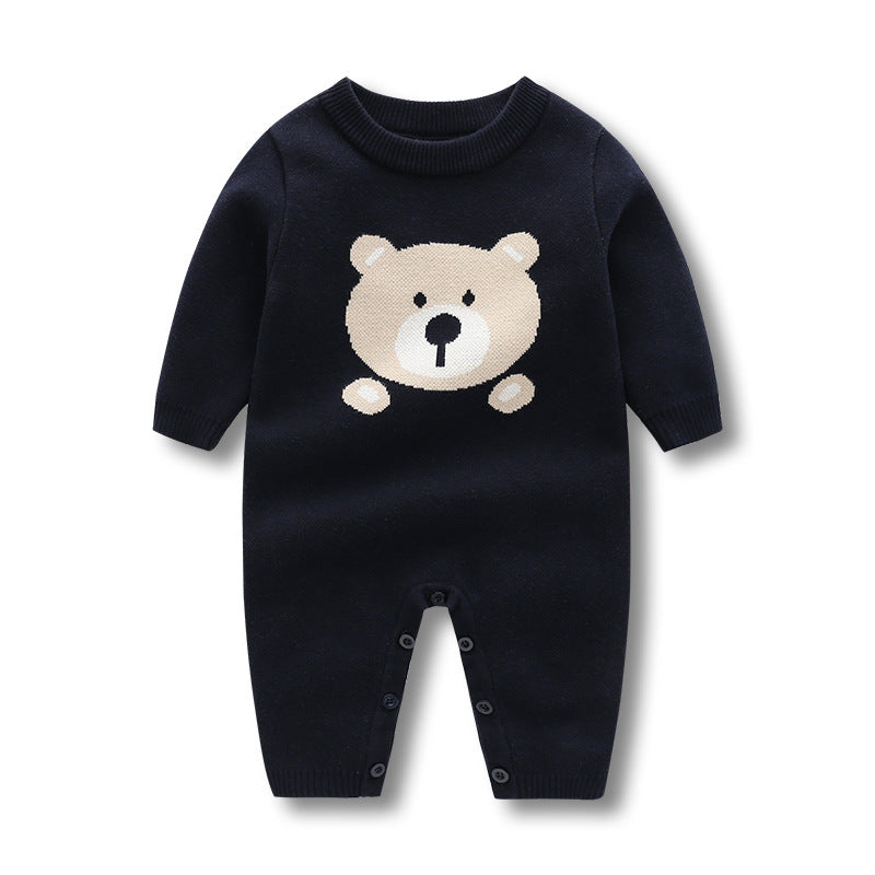 Baby wearing a navy blue long sleeve romper with a cartoon bear pattern, showcasing comfort and style.