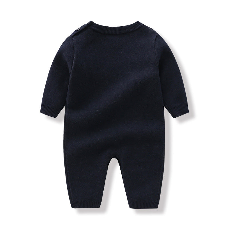 Baby wearing a navy blue long sleeve romper with a cartoon bear pattern, showcasing comfort and style.