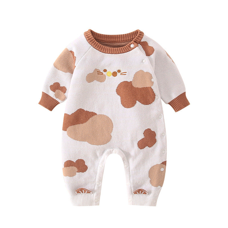 A stylish baby jumpsuit featuring a handknit design with cute cartoon graphics, perfect for infants.