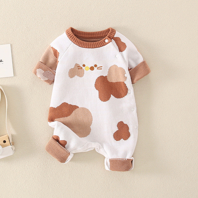 A stylish baby jumpsuit featuring a handknit design with cute cartoon graphics, perfect for infants.