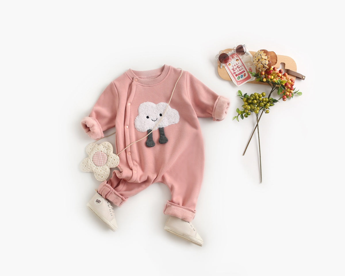 Baby wearing a long sleeved romper with cartoon patterns and side snap buttons, showcasing comfort and style.