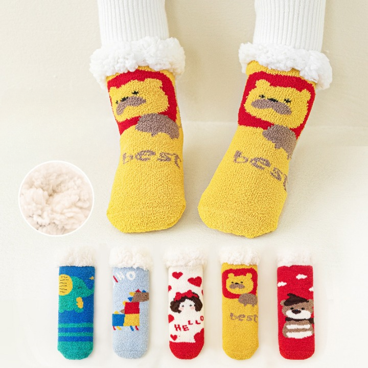 A pair of Baby Cartoon Pattern Thickened Lambswool Coral Fleece Socks in vibrant colors featuring playful cartoon designs, perfect for keeping little feet warm.