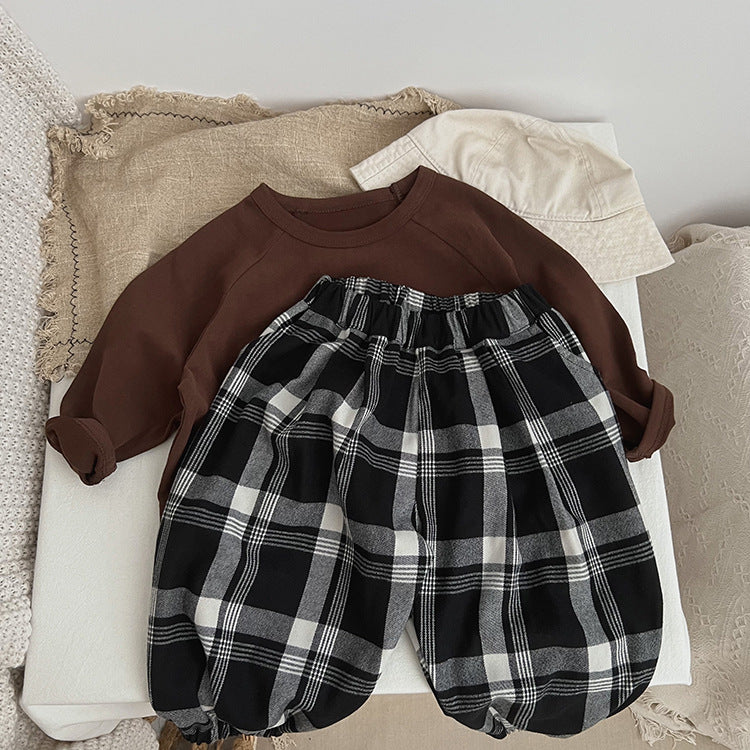 Baby Classic Plaid Pattern Loose Cotton Trousers in black, showcasing a stylish plaid design suitable for both boys and girls.