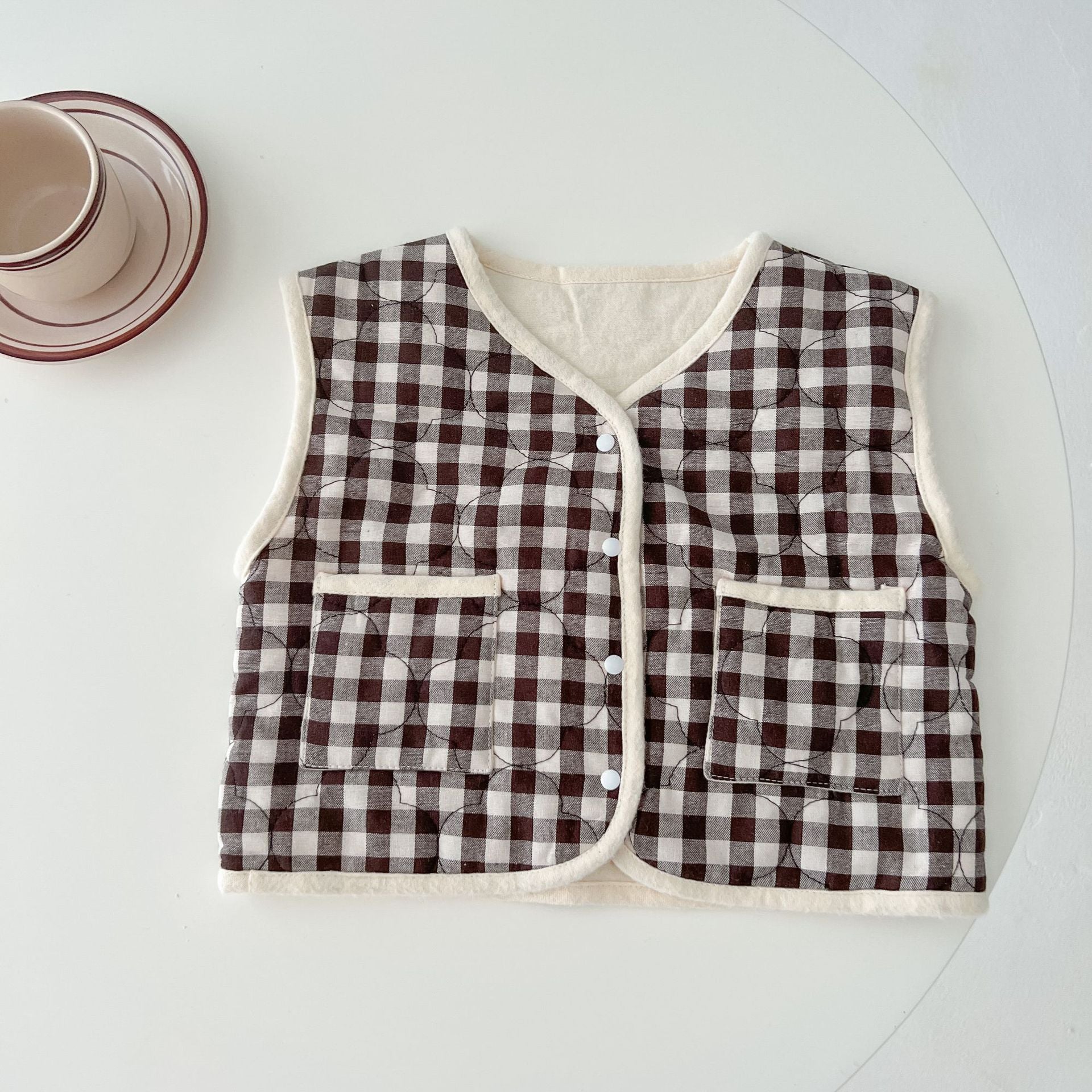 Baby Colorblock Plaid Pattern Sleeveless Thickened Quilted Vest Coat in black and brown, showcasing its stylish design and cozy material.