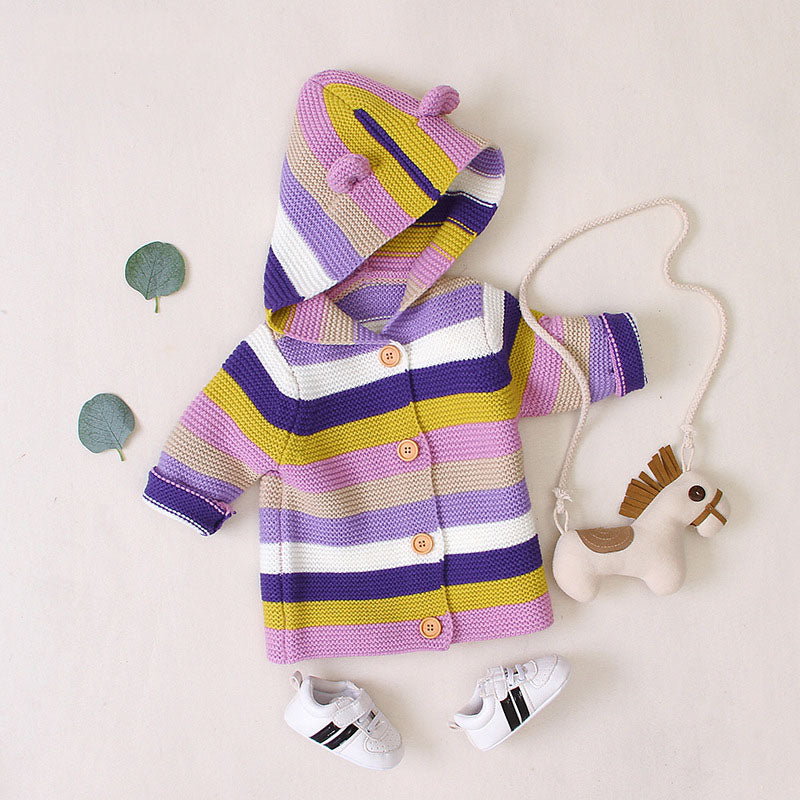 A colorful striped knitted cardigan with button front and matching hat for babies, featuring purple and green colors, perfect for boys and girls.