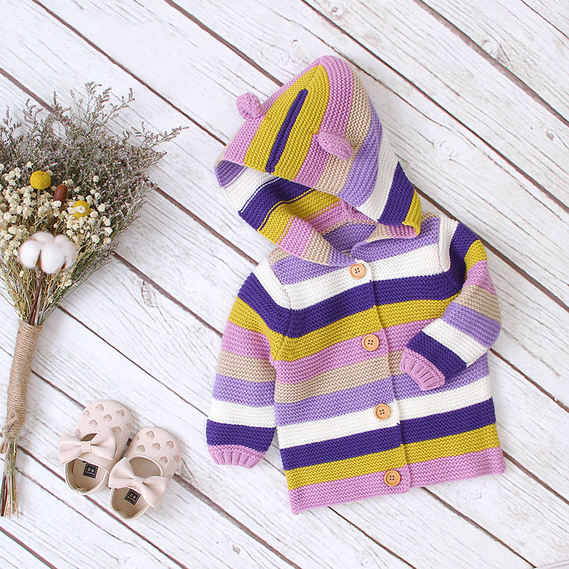 A colorful striped knitted cardigan with button front and matching hat for babies, featuring purple and green colors, perfect for boys and girls.