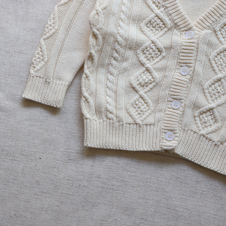 A cozy Baby Crochet Knit Pattern Cardigan in solid beige color with a V-neck and single-breasted design, perfect for infants.