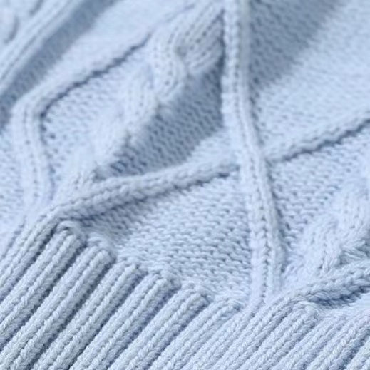 A stylish baby crochet knitting pattern featuring a striped V-neck design in soft cotton, available in white, navy blue, and blue.