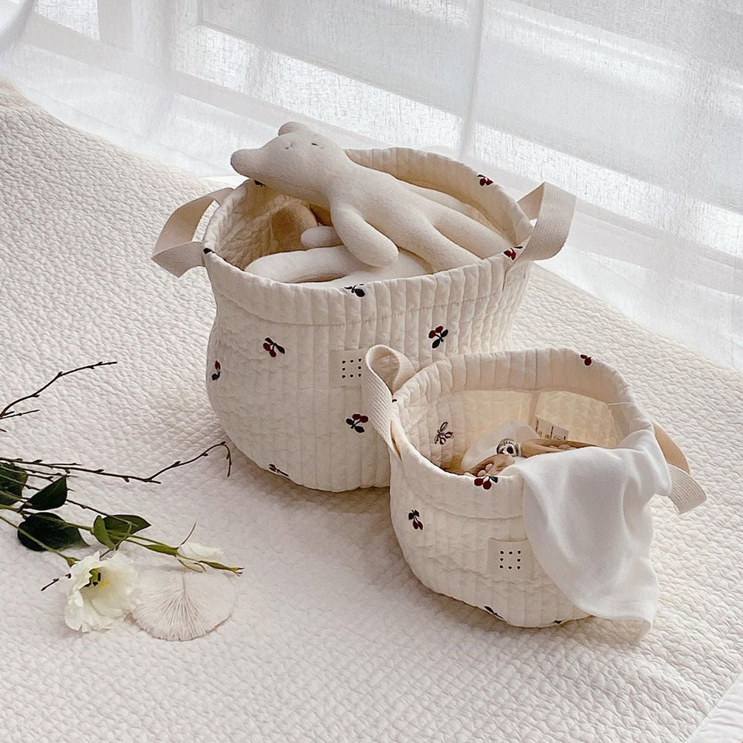 Stylish baby bottle storage basket with embroidered pattern, featuring a convenient handle and available in various colors.