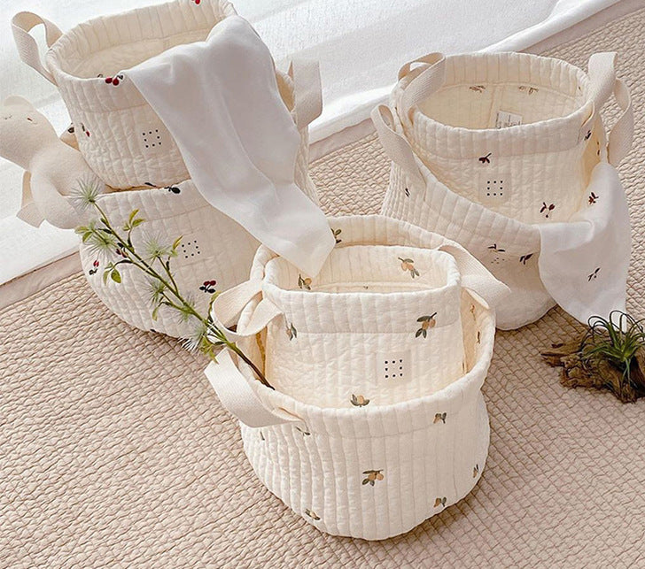 Stylish baby bottle storage basket with embroidered pattern, featuring a convenient handle and available in various colors.