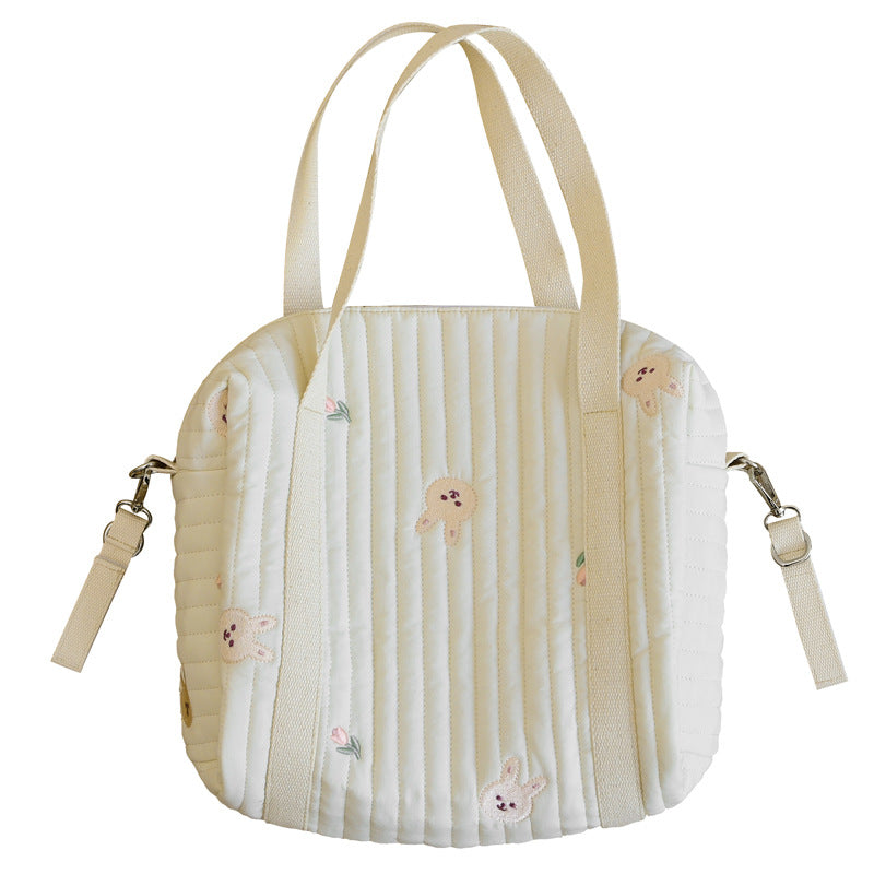 A vibrant Baby Embroidered Pattern Solid Color Storage Mommy Hanging Bag featuring multiple compartments, perfect for organizing baby essentials.