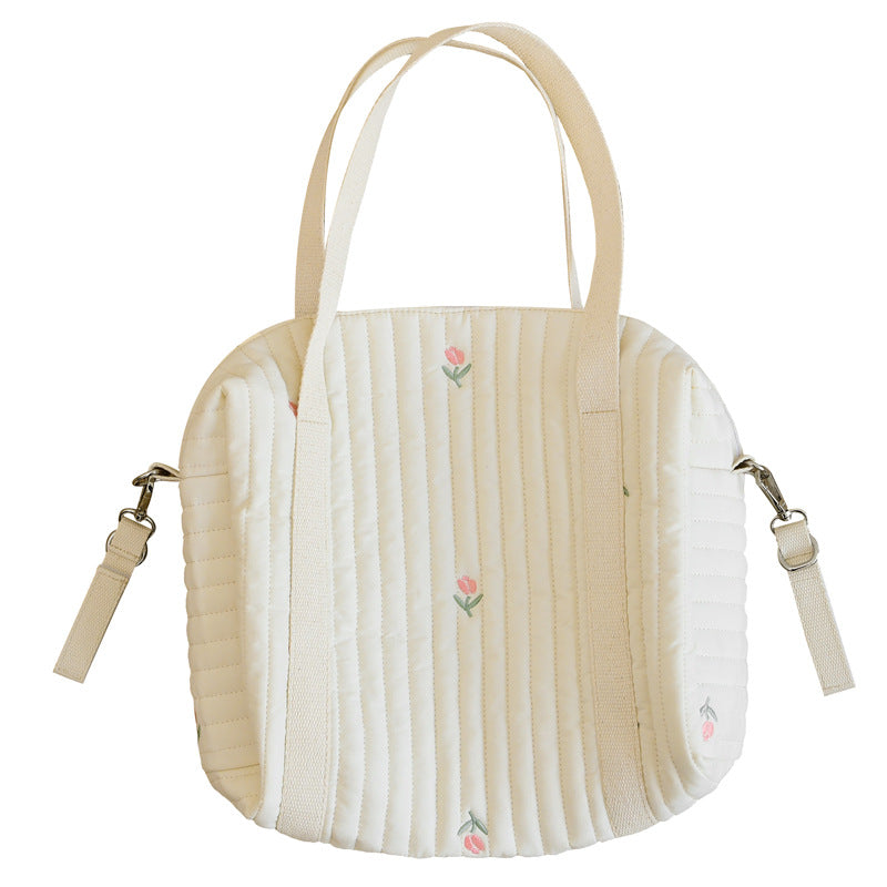 A vibrant Baby Embroidered Pattern Solid Color Storage Mommy Hanging Bag featuring multiple compartments, perfect for organizing baby essentials.