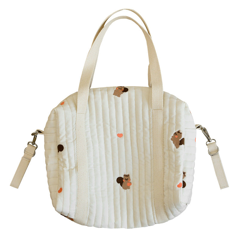 A vibrant Baby Embroidered Pattern Solid Color Storage Mommy Hanging Bag featuring multiple compartments, perfect for organizing baby essentials.