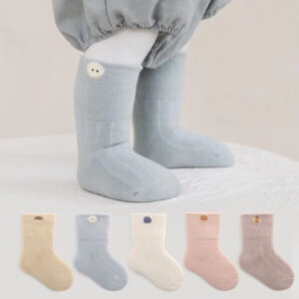 A pair of thickened warm mid tube socks for babies featuring adorable embroidered patterns in various colors.