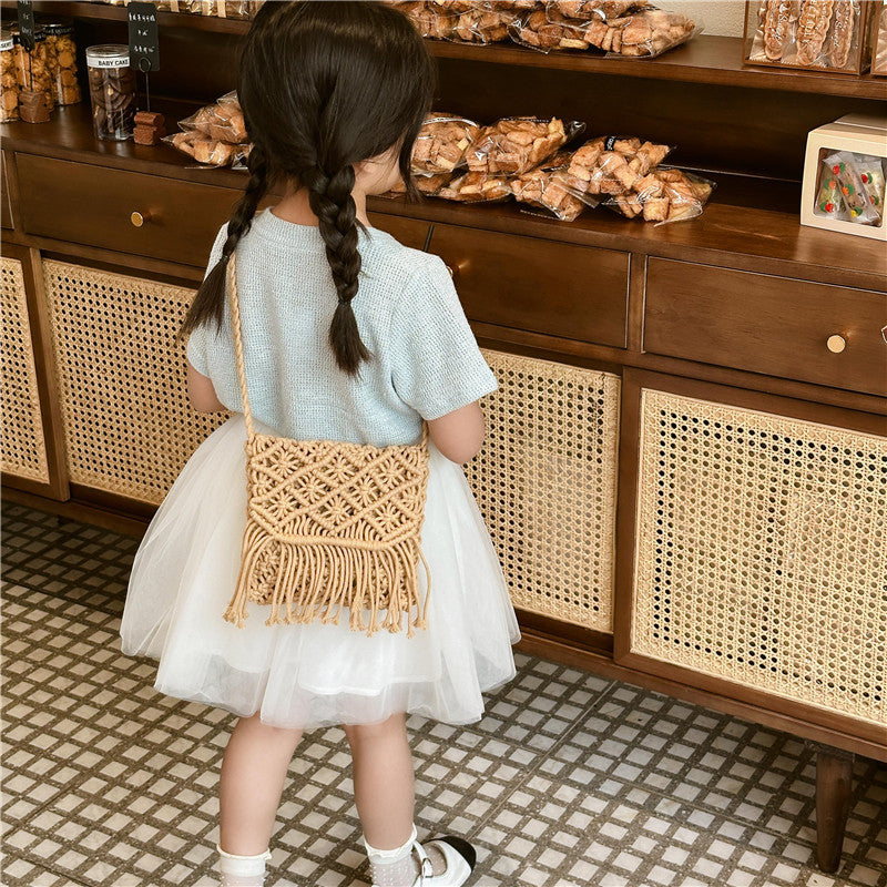 Handmade knitted crossbody bags for baby girls in white and khaki colors, crafted from soft cotton material.