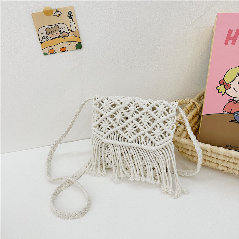 Handmade knitted crossbody bags for baby girls in white and khaki colors, crafted from soft cotton material.