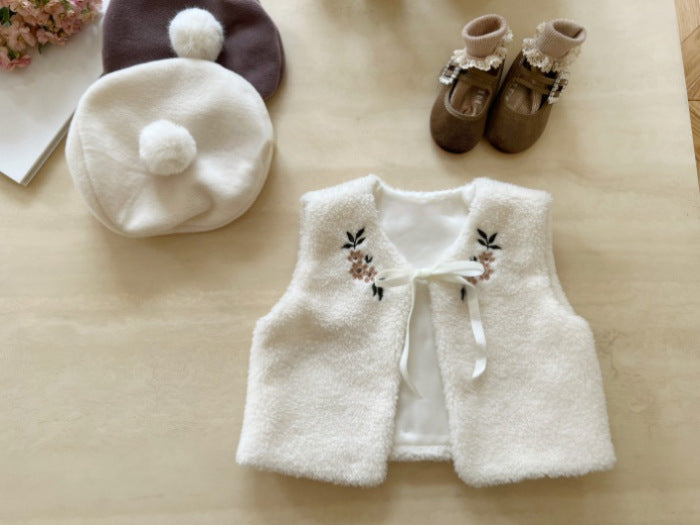 A cozy beige baby vest jacket made of lamb wool, featuring beautiful floral embroidery, perfect for baby girls.