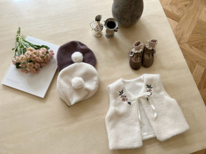 A cozy beige baby vest jacket made of lamb wool, featuring beautiful floral embroidery, perfect for baby girls.