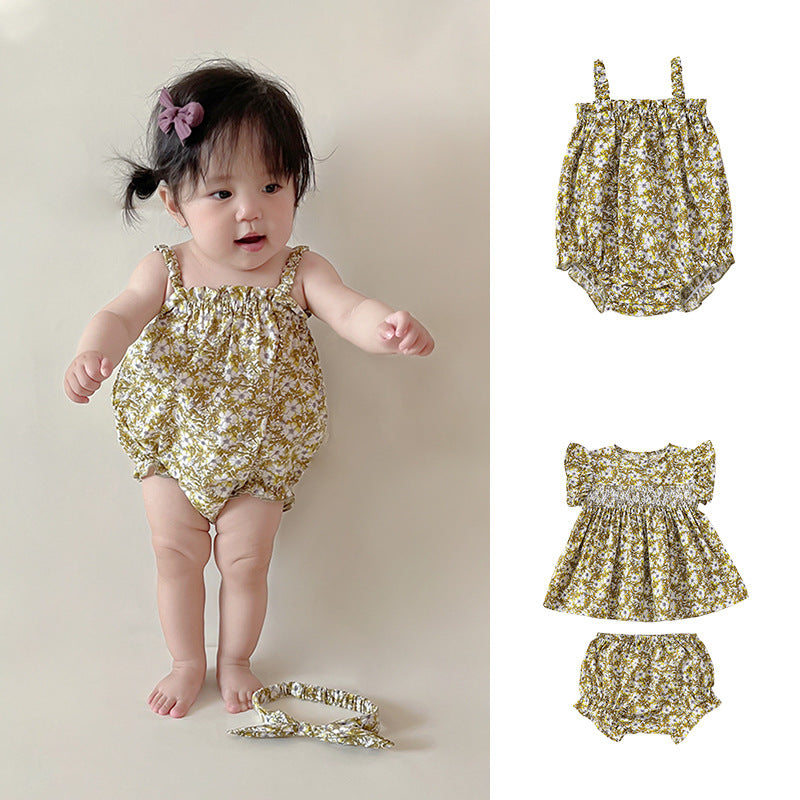 Baby girl wearing a soft cotton summer outfit with a floral pattern in green shades, perfect for warm weather.