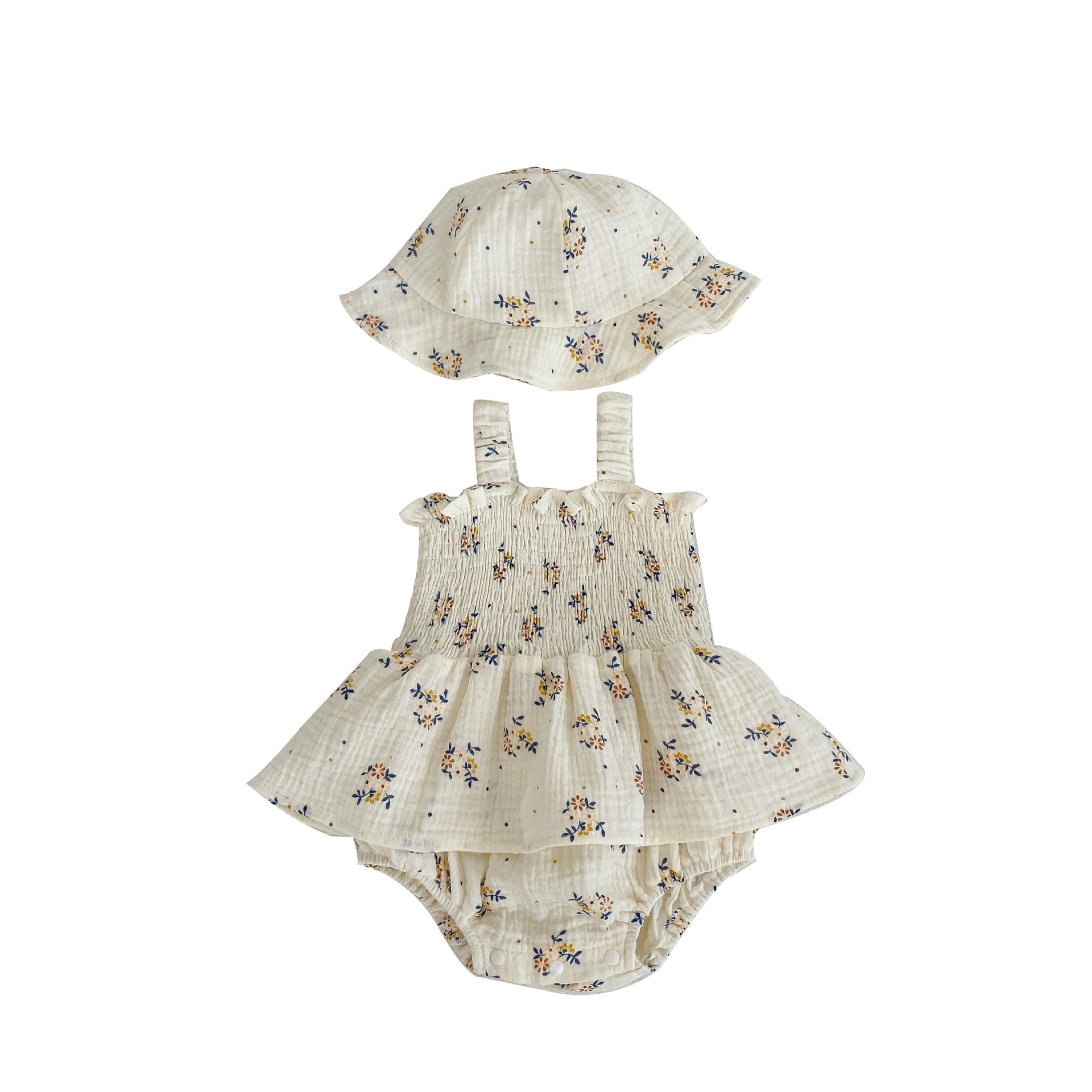 Baby girl wearing a floral sling design onesies dress with a matching hat in apricot color.