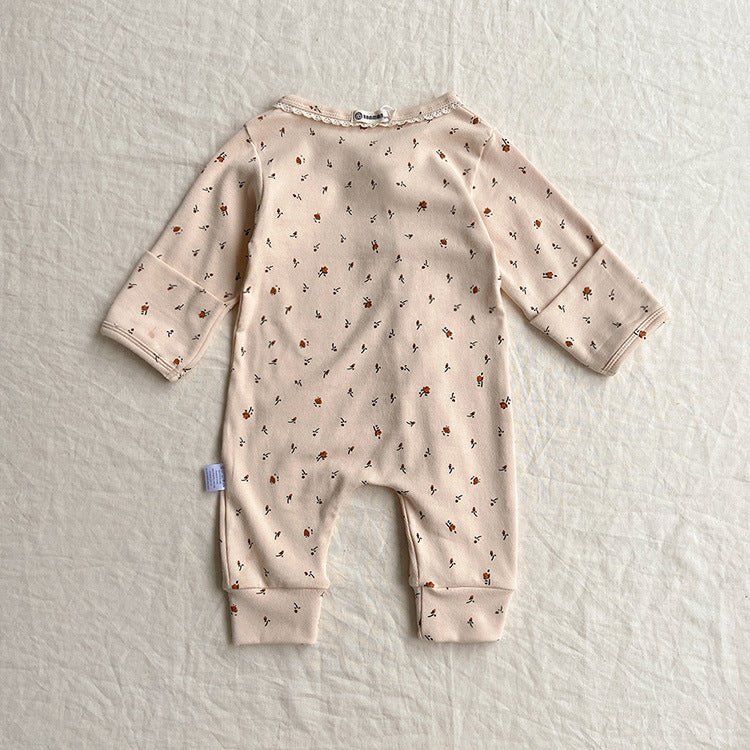 Baby jumpsuit featuring a floral pattern and solid color lace design, button front for easy dressing, available in khaki and apricot.