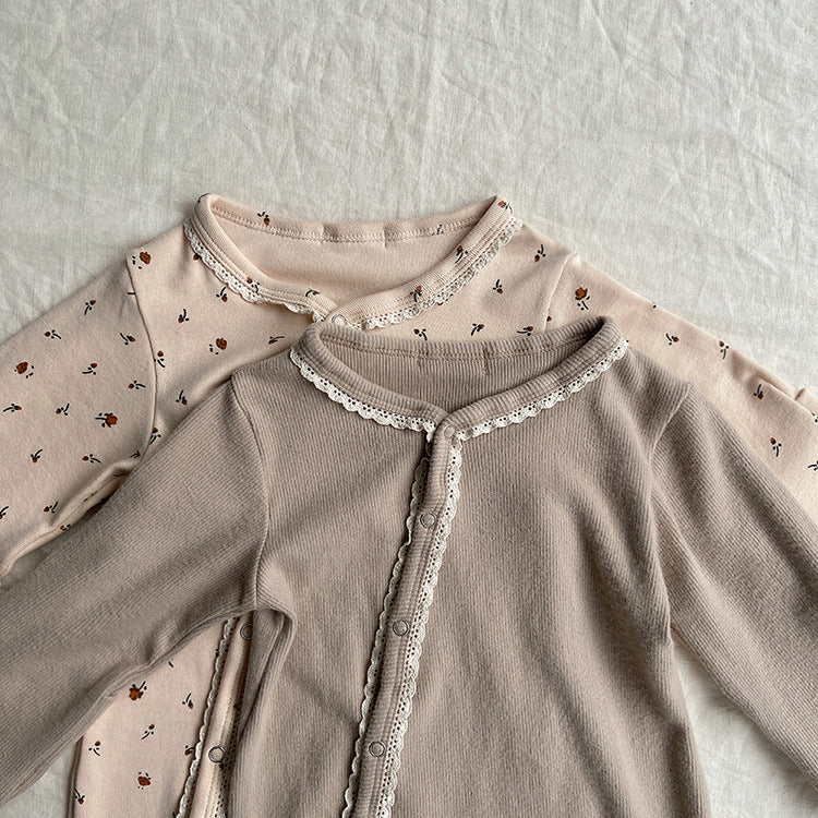 Baby jumpsuit featuring a floral pattern and solid color lace design, button front for easy dressing, available in khaki and apricot.