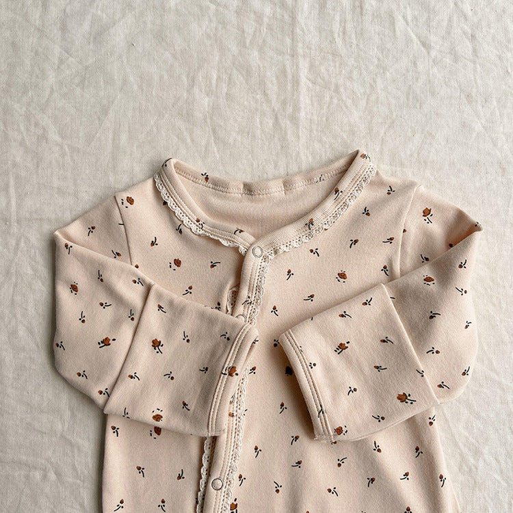 Baby jumpsuit featuring a floral pattern and solid color lace design, button front for easy dressing, available in khaki and apricot.