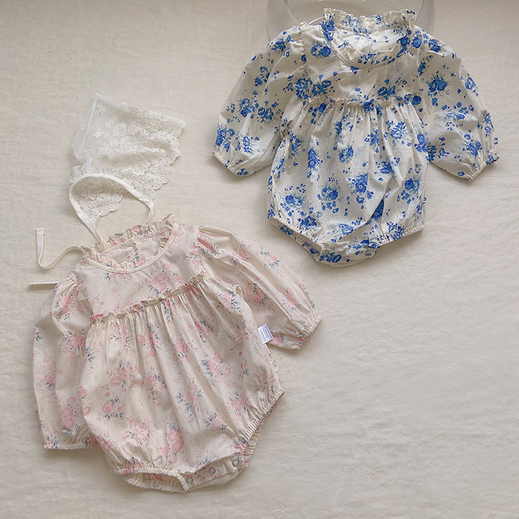 Baby girl wearing a floral pattern long sleeve onesie with a stand collar in pink color, looking adorable and comfortable.