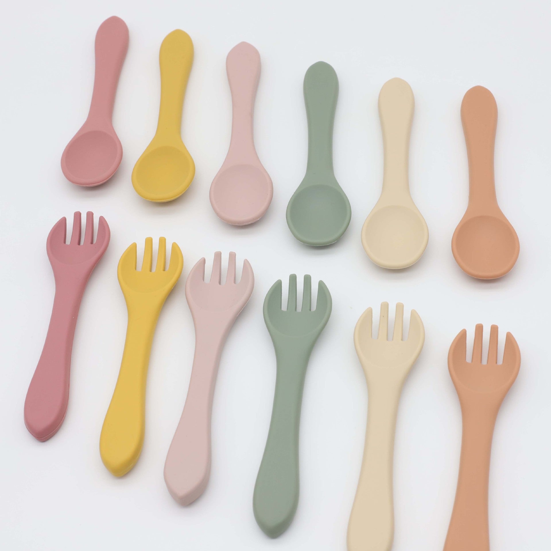 Baby Food Grade Silicone Spoon Fork Set in various colors, designed for safe self-feeding.