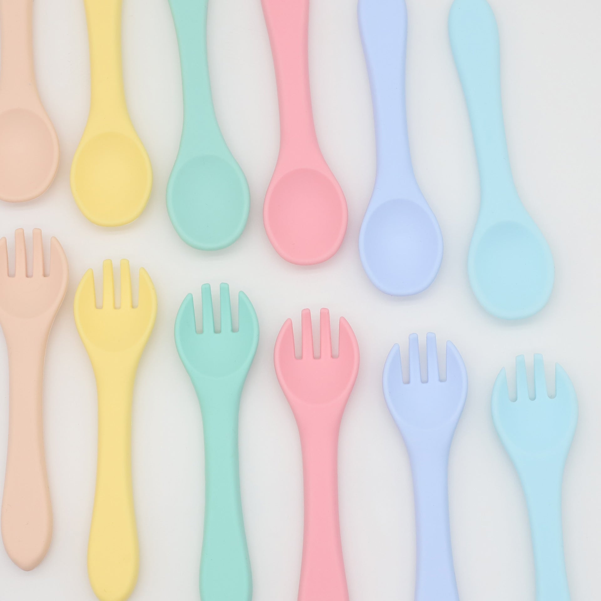 Baby Food Grade Silicone Spoon Fork Set in various colors, designed for safe self-feeding.