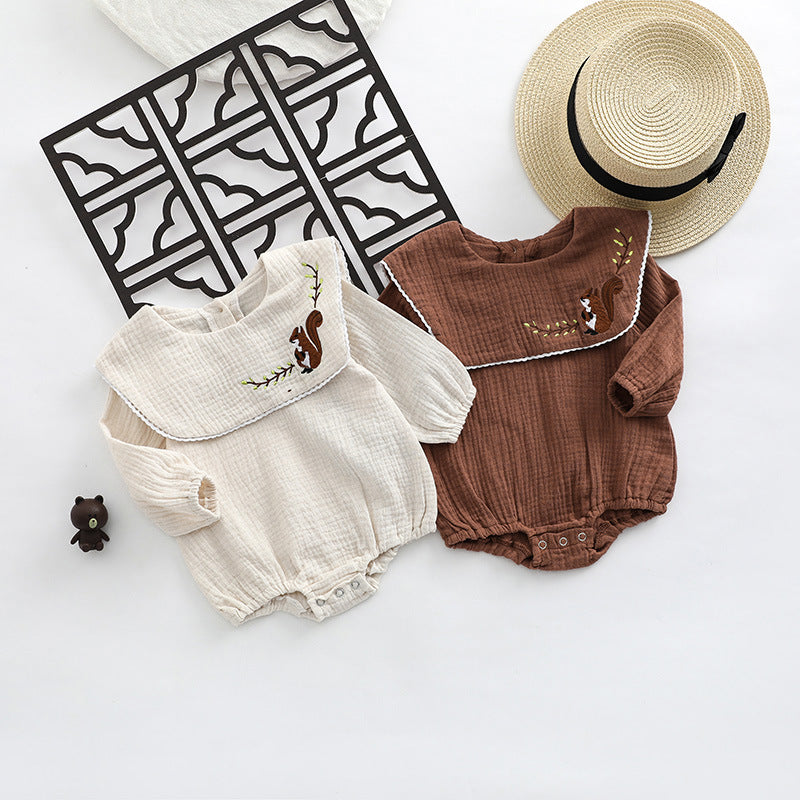 Baby girl onesie featuring animal embroidery and lapel design in beige and coffee colors.